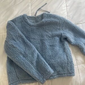 Lululemon blue fluffy crewneck with zipper in the back.